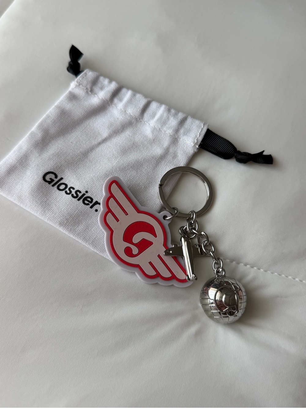 Glossier DC keychain